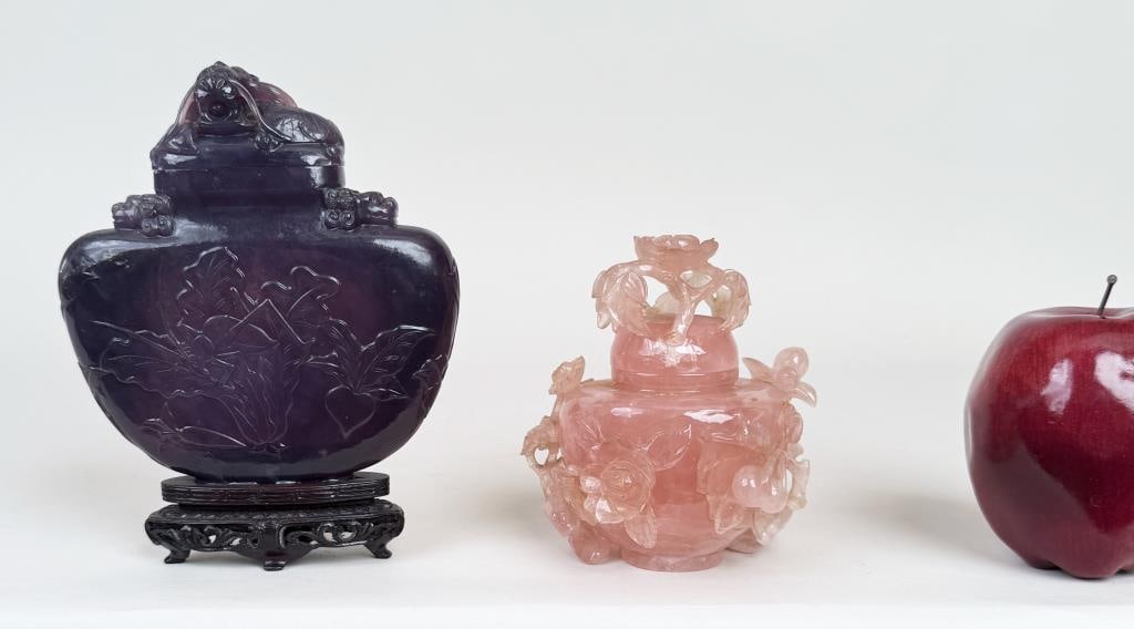 Chinese Lavender Jade Carved Lidded Flask: together with rose quartz lidded jar in censer form. Purple stone with cricket and leaf motif, dragon top, amethyst on base. The larger: 6 1/4" high, 5" wide, 1" deep. Small nicks.