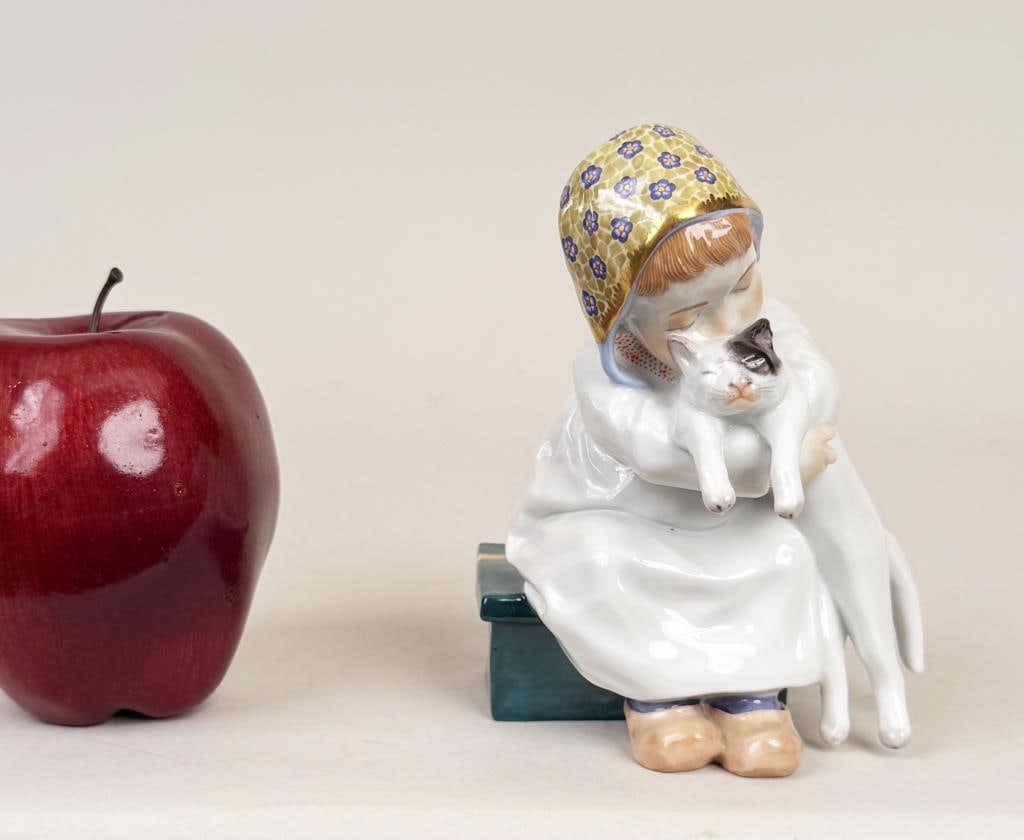 Meissen Hentschel Girl With Cat Porcelain Figure: Konrad Hentschel (1872-1907) for Meissen, porcelain model of a seated young girl with cat, blue crossed swords mark and numbered underside. 5 1/8" high, 3 3/4" wide, 3 1/4" deep.