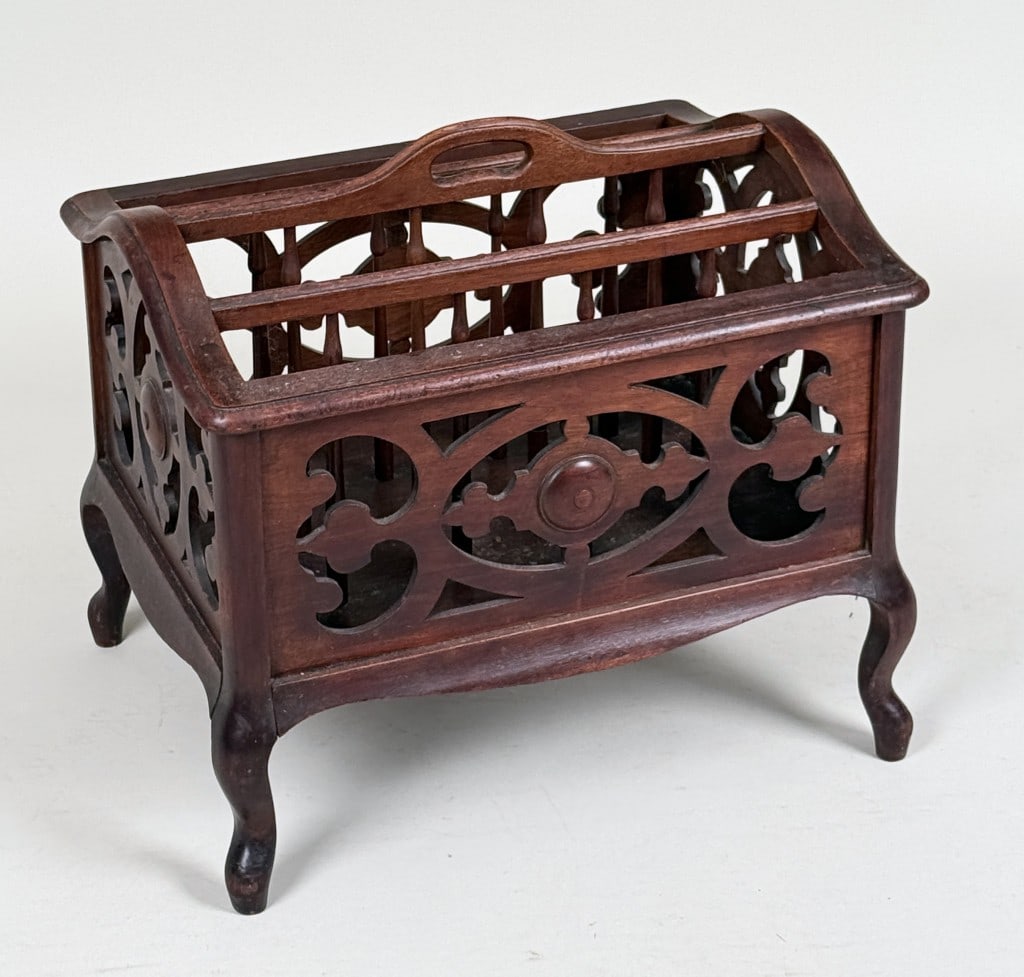 Victorian Carved Walnut Canterbury: with pierced openwork dividers. 19" high, 21" wide, 16 1/2" deep. Age and use wear, scuffs.