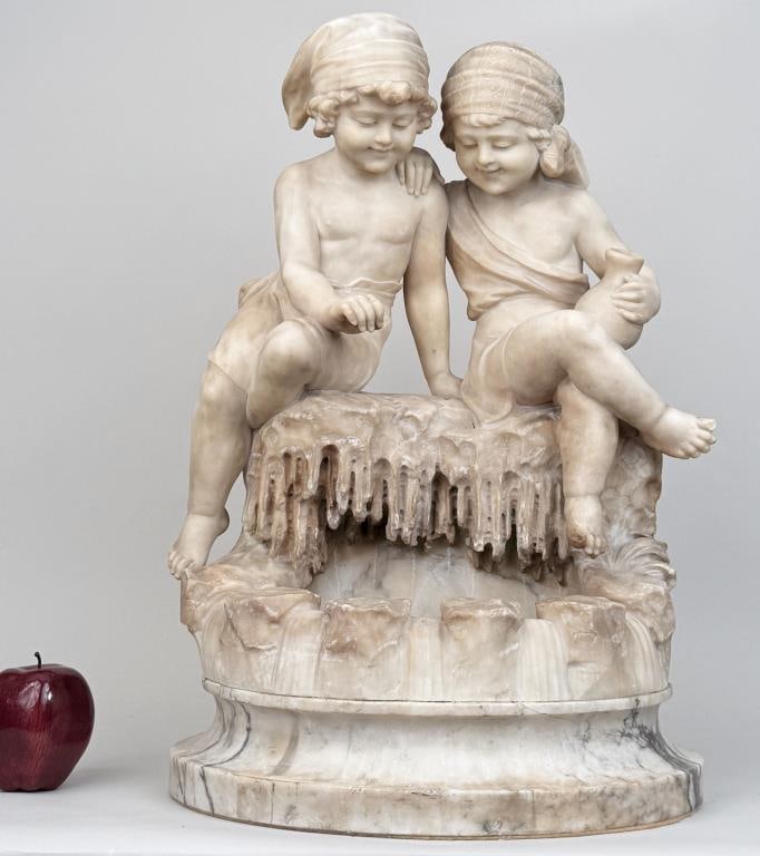 Large Carved Marble Fountain Element: as a planter, with two children looking into pond. 21 1/4" high, 14 1/2" wide, 11 1/2" deep. Soiling, color variations, small repairs.