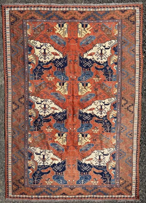 Kilim Carpet: with red ground, blue and white botehs. 10' 5 1/2" long, 7' 10" wide. All rugs sold as is.