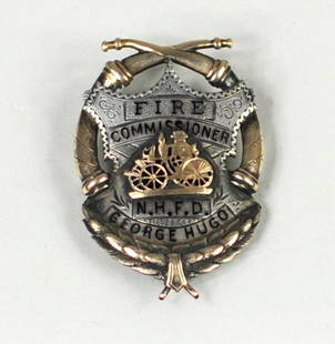 Silver/Gold & Enamel Fire Commissioner's Badge: Vintage silver/gold and enamel fire commissioner's badge, 19th/20th century, inscribed "N.H.F.D. George Hugo", and marked verso "Braxmar NY". 2" wide, 1 1/2" long.