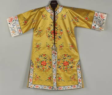 Asian Embroidered Silk Robe: Asian embroidered silk robe, 20th century, with gold ground. 43" high, 49" wide.