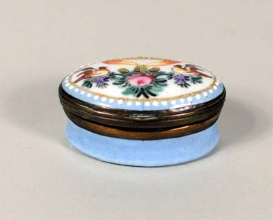 English Enamel Patch Box, 18th/19th Century: English enamel patch box, 18th/19th century, lid with doves and flowers flanking a banner, "Friends Gift", mirror in lid interior. 3/4" high, 1 1/2" wide. Condition: several small cracks to enamel on