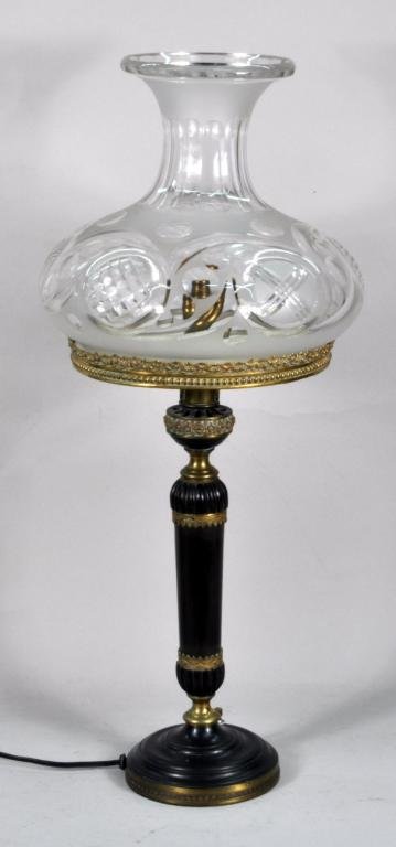 Classical Bronze Ormolu Lamp & Shade: Classical bronze ormolu lamp, 19th century, with elaborate cut glass shade. 25 1/2" high, 11" wide. Condition: patina wear, loss, oxidation, rust, paint loss to interior of metal shade support.