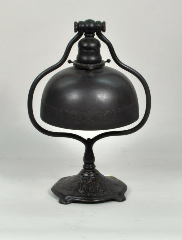 Tiffany Bronze Zodiac Table Lamp: Tiffany Studios bronze zodiac table lamp, early 20th century, stamped on base "Tiffany Studios New York #661". 13 1/4" high, 9 1/4" wide. Condition: scattered patina wear, loss