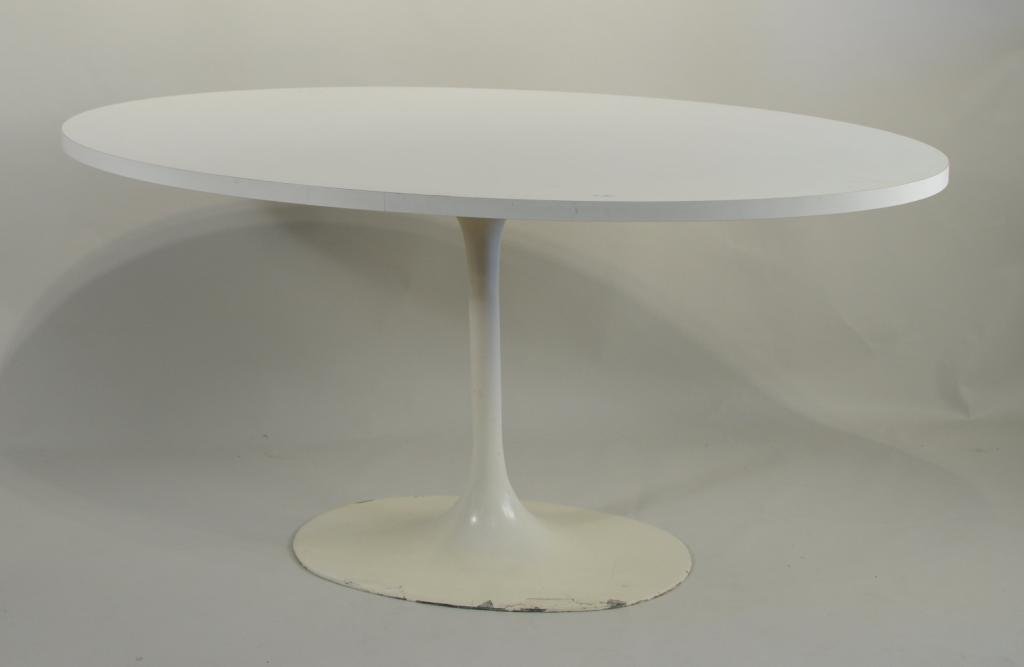 Eero Saarinen For Knoll Oval Dining Table: Vintage Knoll mid-century oval Eero Saarinen dining table, of classic form with sculpted pedestal base. 29 3/4" wide, 59 1/4" long, 29" high. Condition: Some wear and paint damage to parts of base.