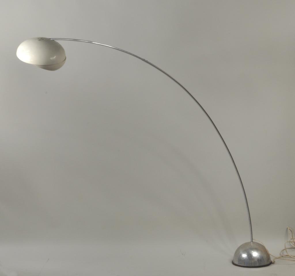 Mid Century Arc Lamp by Cassina, 1967: Mid century arc lamp by Cassina, circa 1967, oval white metal shade on chrome weighted base. 69 3/4" high, 70" wide. Condition: base with chrome wear, scratches, oxidation, dents, shade with finish we