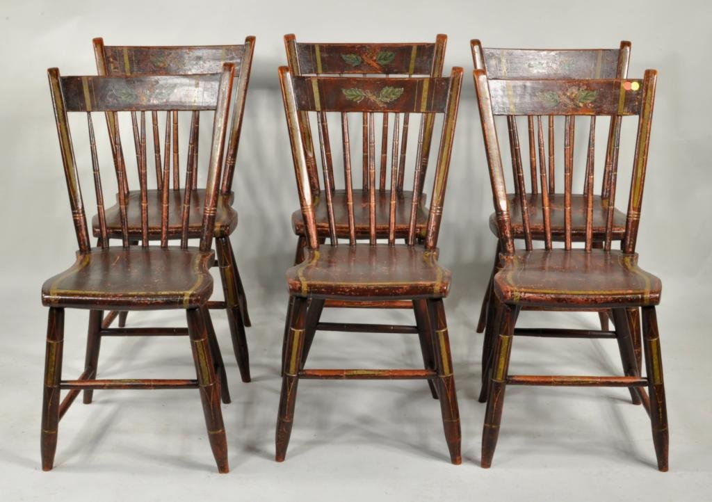 Set Six Decorated Thumb Back Windsor Side Chairs: Set of six American thumb back Windsor side chairs, 19th century, in dark red paint with yellow striping, crest rails with twig and leaf decoration. 32 1/2" high, 17 1/2" wide, 14 3/4" deep. Condition