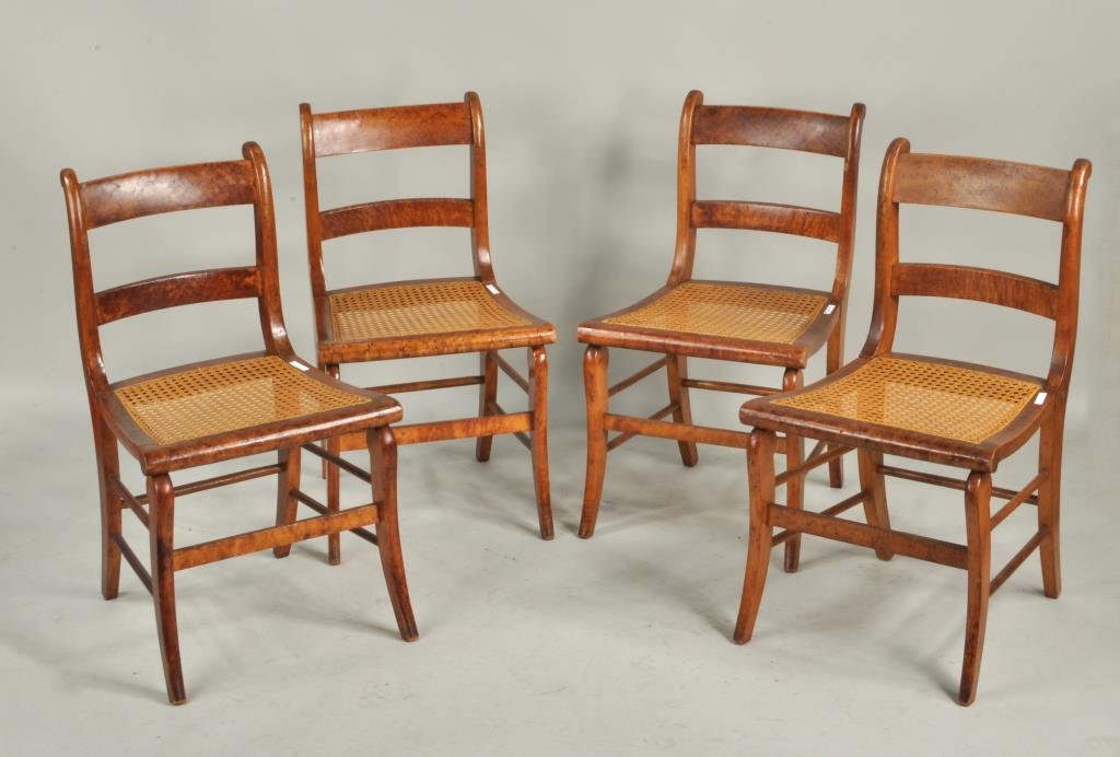 Four American Empire Side Chairs: Four American birdseye and curly maple side chairs, 19th century with caned seats. 32 1/4" high, 18" wide, 16 1/2" deep. Condition: finish wear, loss, one with repaired back leg.