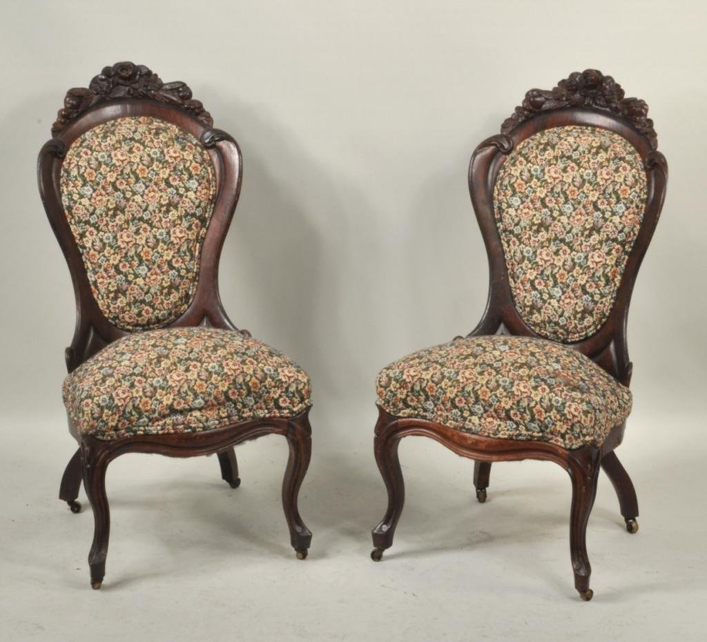 Pair of Belter Laminated Rosewood Side Chairs: Pair of John Henry Belter laminated Rosewood side chairs, 19th century, with florally carved crest rails, oval upholstered backs, seat with serpentine front rail and shaped legs on casters. 36 3/4" hi