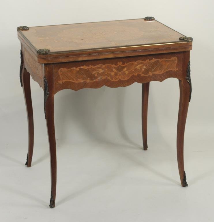 Louis XVI Marquetry Bronze Mounted Game Table: Louis XVI Marquetry bronze mounted game table, 20th century, top with mixed woods, floral inlay, bronze shell form corner mounts, top opens to a felt playing surface, over single drawer with felt back
