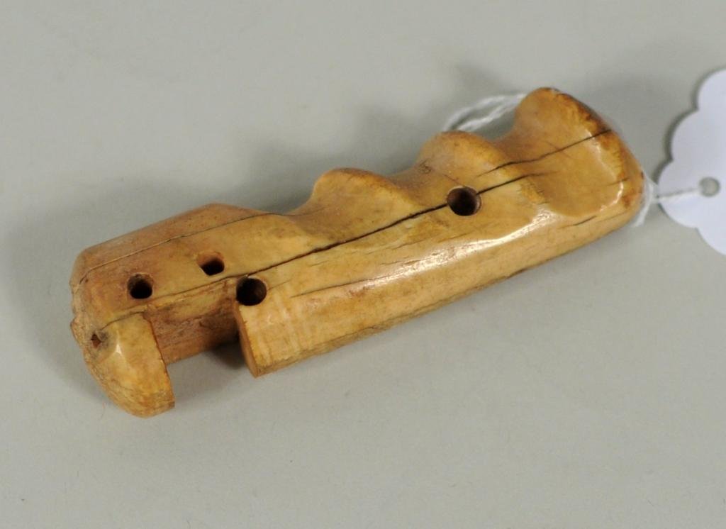 Inuit Marine Ivory Tool Handle, 19th C.: Inuit marine ivory tool handle, 19th century., end with carved human face. 3 3/4" long, 1 1/4" wide. Condition: wear, stains, age cracks. NO INTERNATIONAL OR CALIFORNIA SHIPPING.