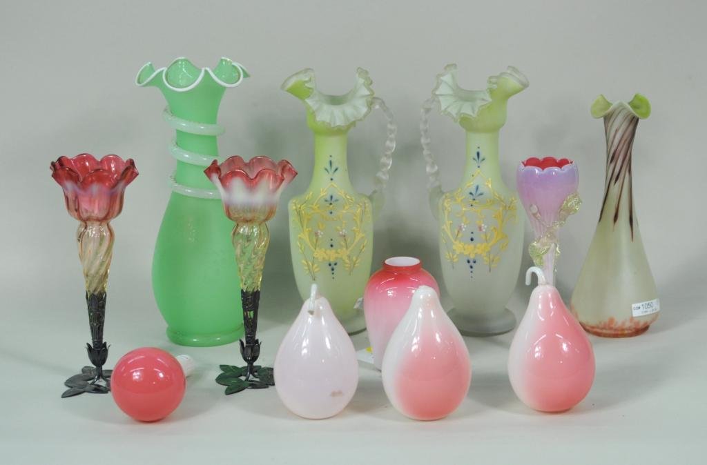 Twelve Victorian Glass Items: Twelve Victorian glass items, 19th century, including a pair of pink and white ruffled trumpet form vases on silver plate stands, a pair of pale yellow ewers, four pink and white hand blown fruits and