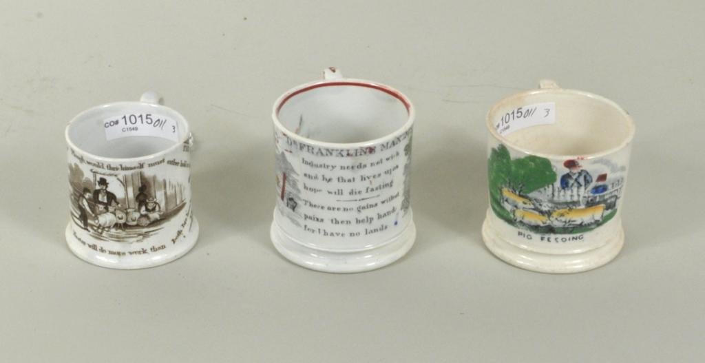 Group Three Staffordshire Transferware Mugs: Group of three Staffordshire transferware pottery mugs, 19th century, comprising a Dr. Franklin's child's, a Maxim mug and "Pig Feeding". 2 1/2" high, 3 1/2" wide to 3" high, 3 3/4" wide. Condition: a