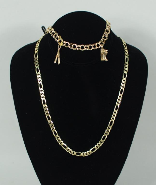 14K Yellow Gold Bracelet & Necklace: Two 14K yellow gold items, 20th century, comprising a charm bracelet with two charms and extra link and an Italian link chain necklace. Weight 30.9 dwt. Chain: 20" long; bracelet: 8" long. Condition: 