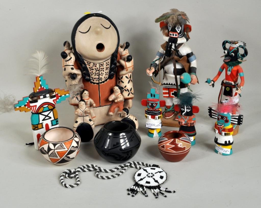 Group of SW Native Ameican Items, 20th C.: Twelve Native American items, 20th century, including a large Cochiti storyteller by Mary Trujillo signed on base, a signed small Lucy M Lewis Acoma pot, a black pot signed Helen Gutierrez - San Ildif