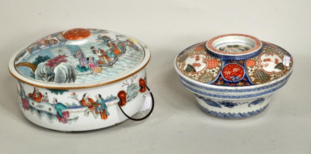 Two Asian Porcelain Serving Dishes: Two Asian porcelain serving dishes, 19th century, comprising a large Chinese metal handled covered dish, lid with enameled scene of figures in a courtyard together with a Japanese Imari covered bowl. 