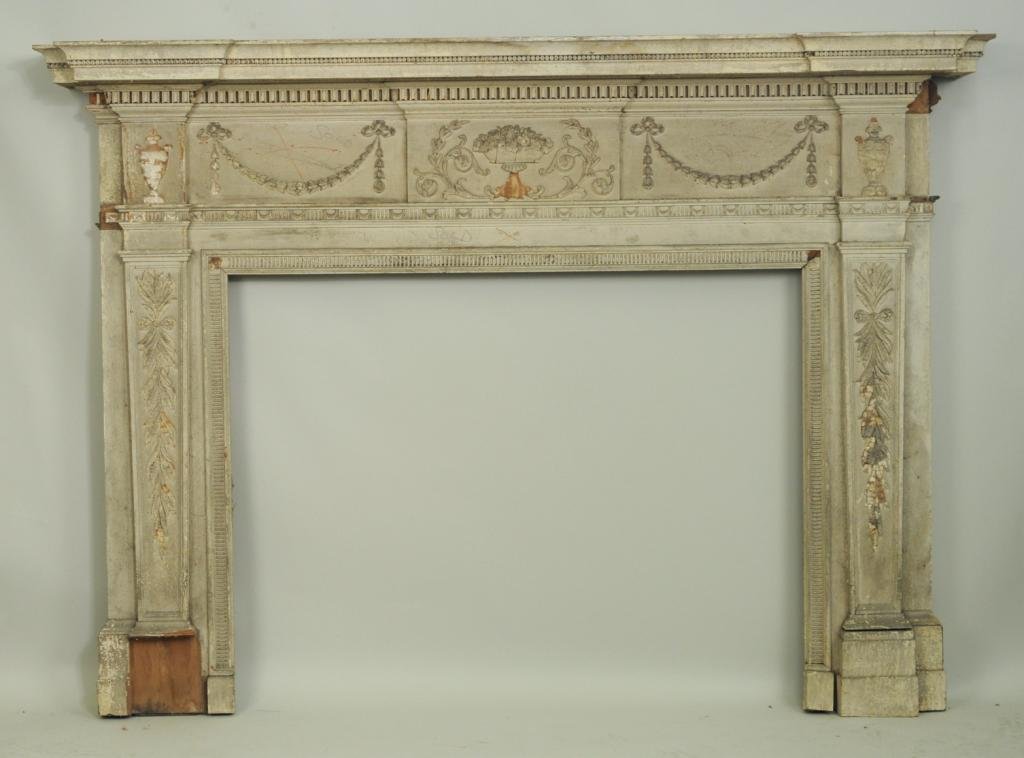 Federal Carved Fireplace Mantle: Federal carved fireplace mantle, 19th C., with square shaped top, surround with applied urn and swag decoration, sides with wheat and ribbon sprays on square shaped supports. 60 1/2" high, 83 1/2" wid