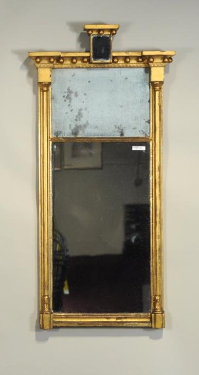 Federal Gilded Architectural Mirror, Raised Tablet: American Federal carved and gilded architectural mirror, with raised framed glass tablet, above a split mirror plate, framed with carved and gilded beadwork. Probably New York, 19th century. 41" high,