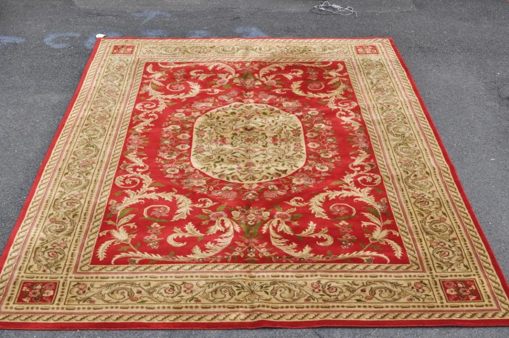 Aubusson Style Room Size Carpet: Aubusson style room size carpet, 20th century, with cream acanthus leaf and floral sprays on a red ground, cream floral vine border. 13'6" long, 9'3" wide. Condition: all rugs sold as is.