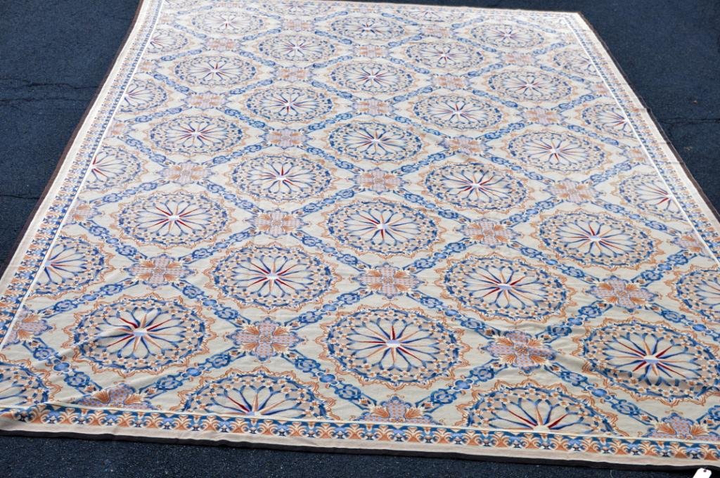 Continental Aubusson Style Needlework Carpet: Continental Aubusson style needlework carpet, 20th century, with repeat pattern of pink and blue central floral medallions in latticework design on a cream ground with a similar border, 22"3" long, 13