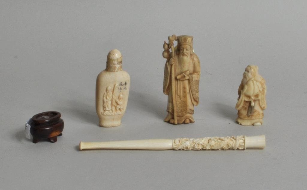 Four Asian Carved Ivory Items: Four Asian carved ivory items,19th/20th century, comprising: snuff bottle, netsuke, elder figure and cigarette holder. 2" high, 1" wide to 5 7/8" long, 1/4" wide. Condition: age cracks, bases with glu