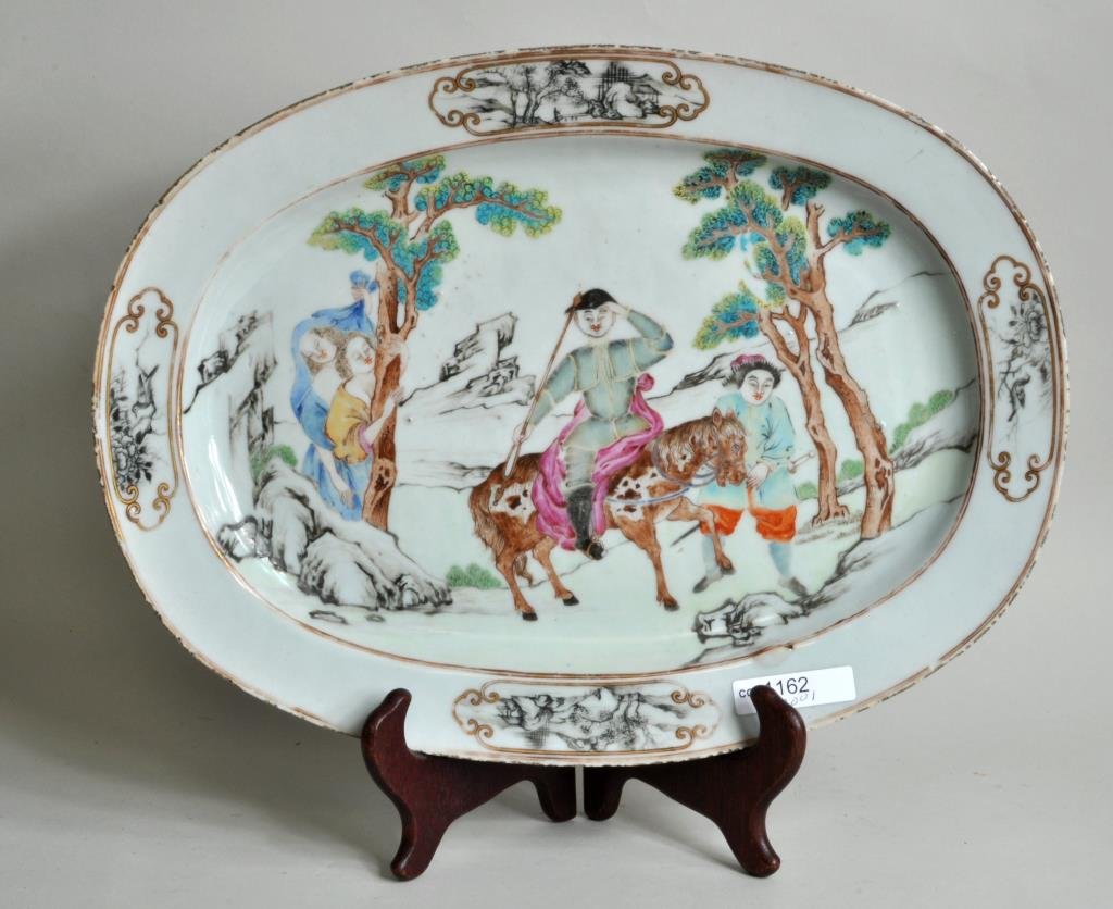 Chinese Export Porcelain "Don Quixote" Platter: Chinese export porcelain famille rose "Don Quixote" oval platter, circa 1750-60, the center enameled with Don Quixote in full armor, astride his horse holding a lance, Sancho Panza holding the reigns 