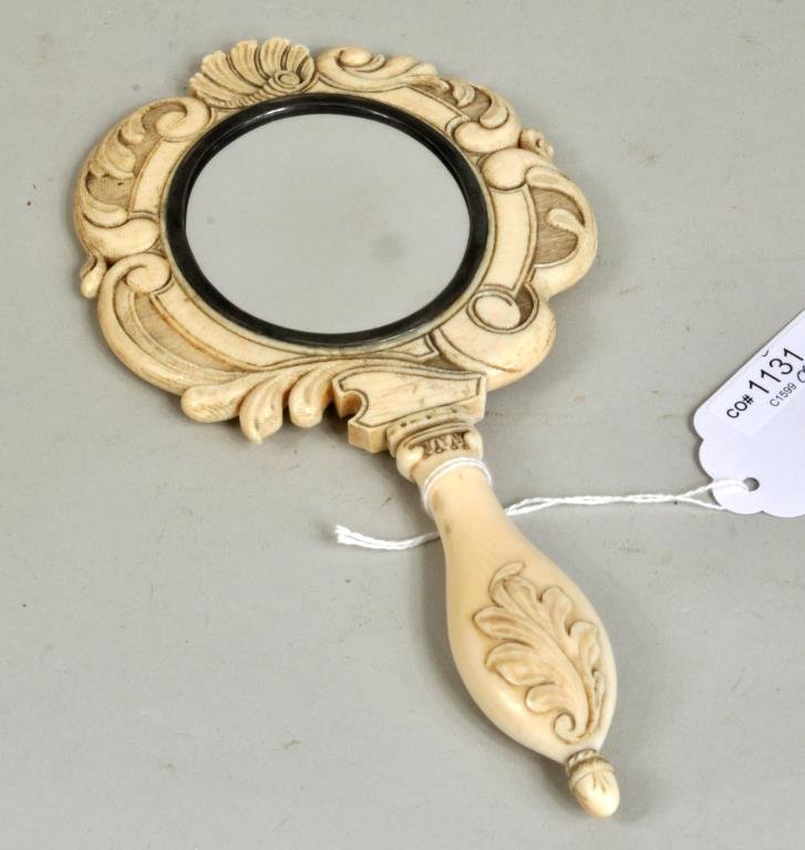 Continental Carved Ivory Hand Mirror: Continental carved ivory hand mirror, 19th century, with hand painted ivory portrait of lady, unsigned. 9 1/2" high, 4 3/4" wide. Condition: age cracks, portrait with stains. . NO INTERNATIONAL OR CAL