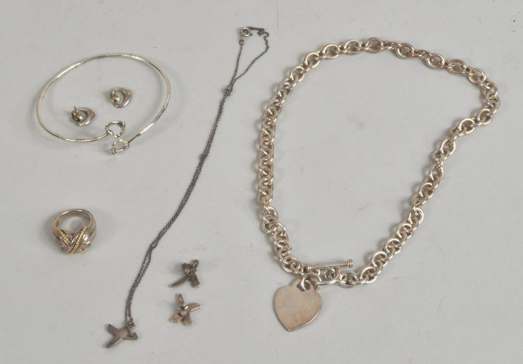 Six Tiffany Sterling Silver & Gold Jewelry Items: Six Tiffany & Company sterling silver and gold jewelry items, 20th century, comprising: an 18K and sterling ring, heart necklace, Paloma and Elsa Peretti necklace and earrings. 3/8" diameter to 16" lo
