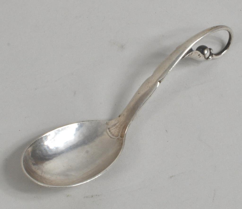 Georg Jensen Sterling Silver Spoon: George Jensen sterling silver spoon, 20th century, stamped "Georg Jensen & Wendel A/S". 5 1/4 " long, 1 1/2" wide, .96 troy oz. Condition: bowl with dent.