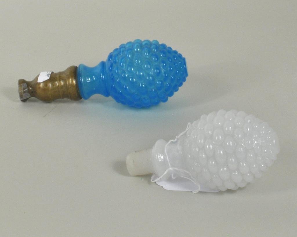 Two Sandwich Glass Newel Post Finials: Two Sandwich glass newel post finials, 19th century, comprising an electric blue finial and a Boston Sandwich Co. hobnail clambroth finial, see B3 Kaiser Vol 3 pg. 66 for a similar example. 6" long, 3