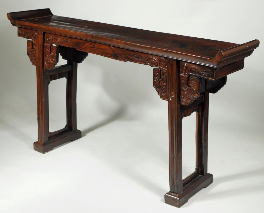 Chinese Carved Hardwood Altar Table: Chinese carved hardwood altar table, 18th/19th century, foliate carved front apron on carved legs and supports. 37 1/2" high, 69" long, 14" deep. Condition: age cracks, separations, top surface with c