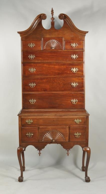 Chippendale Carved Walnut Bonnet Top Highboy: Chippendale carved walnut bonnet top highboy, 18th/19th century, top with double scrolled moulded cresting flanking urn and flame finial, shell carved middle drawer flanked by two short drawers over f