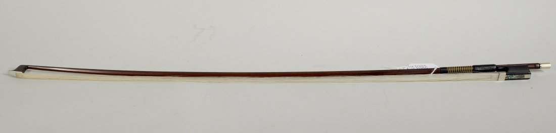 Violin Bow, Stamped "Charles Bazin": Violin bow,stamped "Charles Bazin",in "as is" condition,. 28" long, 1" wide. Weight: 62.86 grams.