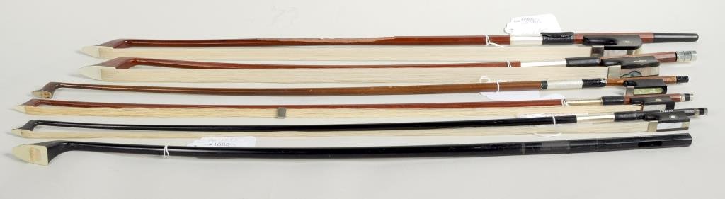 Three Bass Bows & Three Violin Bows: Three bass bows and three violin bows, in "as is" condition. Four stamped from top: " Presto", "E.R. Ernst", "Reig", "Presto" and two unmarked. 27 1/4" long, 1 1/2" wide to 29 1/2" long, 2 1/2" wide. 