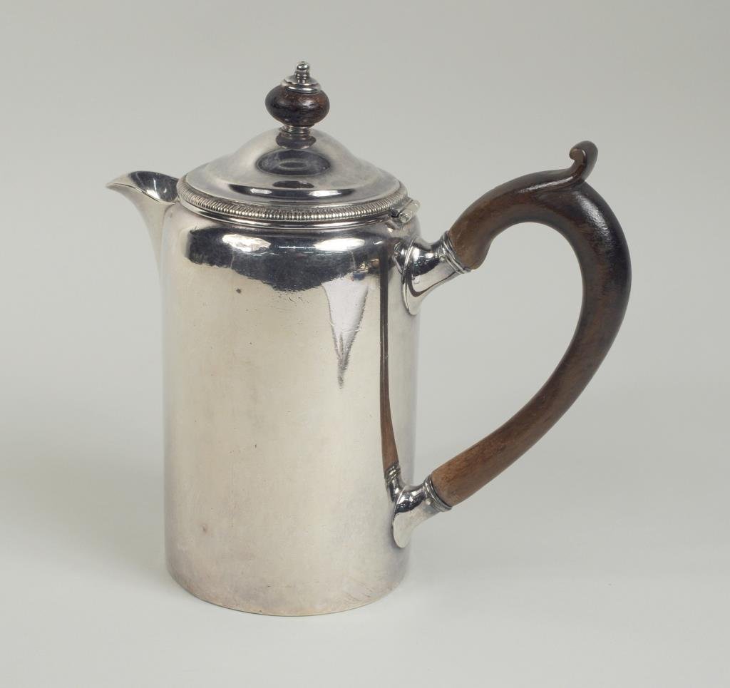 English Sterling Silver Coffee Pot: English sterling silver coffee pot made in London in 1803, makers' mark RS for Robert Salmon with wood handle and knop, 8" high, 8" wide. Gross weight: 23.245 OZT. Condition: light scratches, small ni