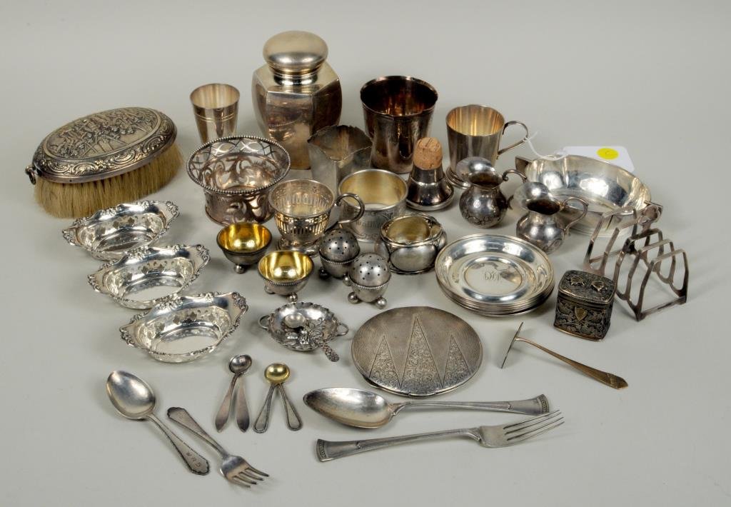 Sterling Silver .800 Silver and Other Items: Sterling silver .800 silver and other items including a sterling tea caddy made for Tiffany & Co., a Black, Starr & Gorham child's cup, six small monogrammed dishes and seven other small items, in .80