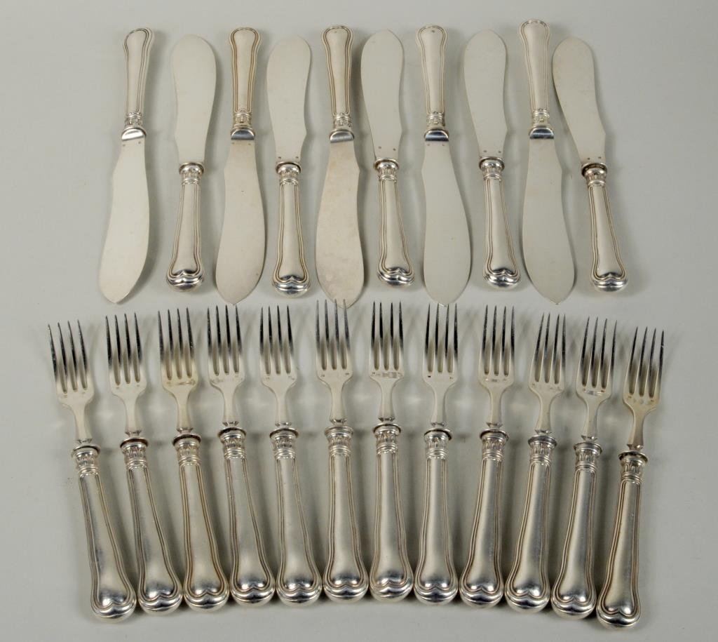 Continental Silver Partial Fish Service: Continental silver partial fish service in the Fiddle and Thread pattern, 19th century, comprising twelve forks and ten knives, hallmarked Alfe Nide and a second crest mark, 7 1/4" long, 3/4" wide to 