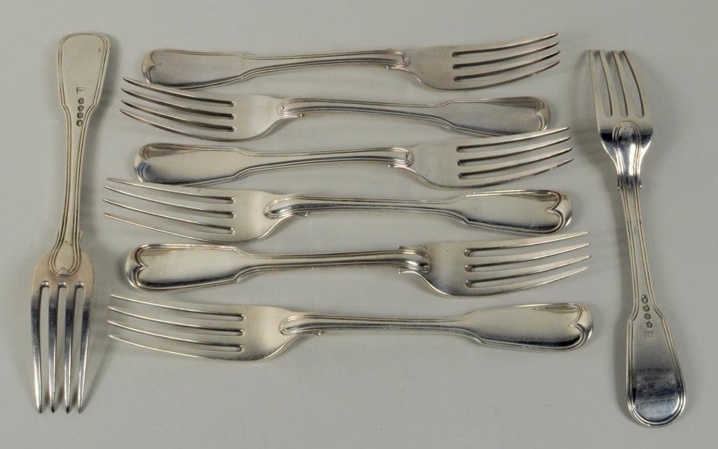 Eight English Sterling Silver Dinner Forks: Eight English sterling silver dinner forks in the Fiddle and Thread pattern, 19th century, comprising five made in London in 1806, makers' mark WH WF, marks rubbed, two with armorial crests made in Lo
