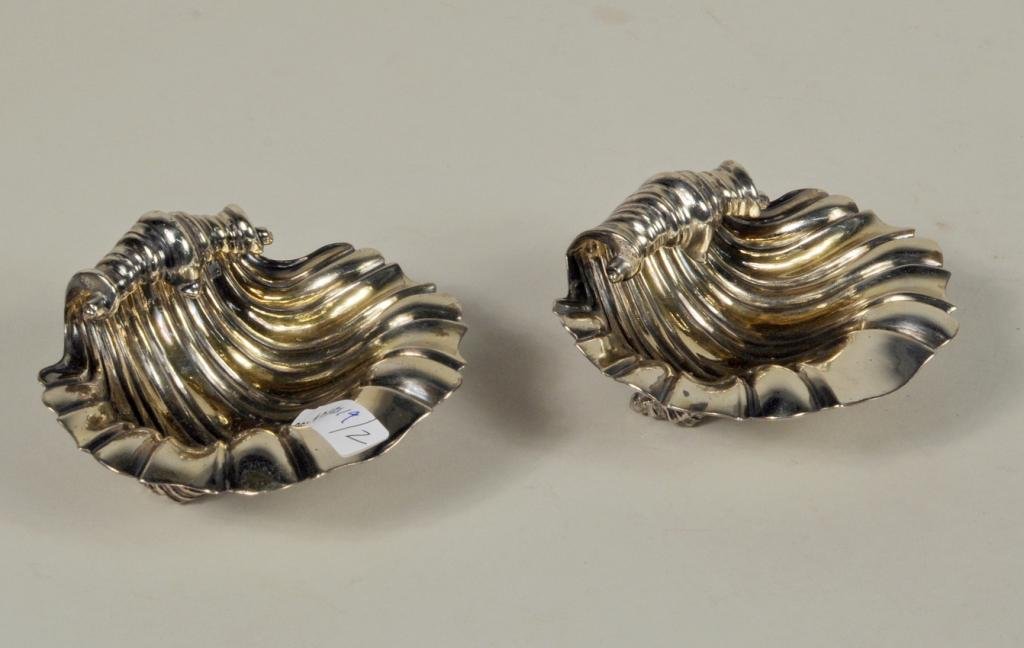 Pair of Georgian Silver Shell Form Salts: Pair of Georgian sterling silver shell form salts with armorial crests, made in London in 1830, makers' mark "EH B JW" for Edward, John and William Barnard, 3 7/8" wide, 3 1/2" deep. Weight: 8.99 OZT.