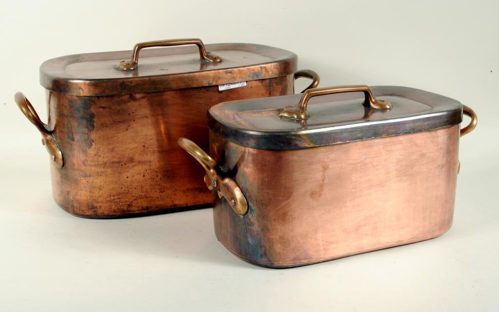 Two Copper Dutch Ovens: Two large copper dutch ovens. 8 1/2" high, 17 1/2" wide to 10" high, 20 1/4' wide. Condition: use wear.