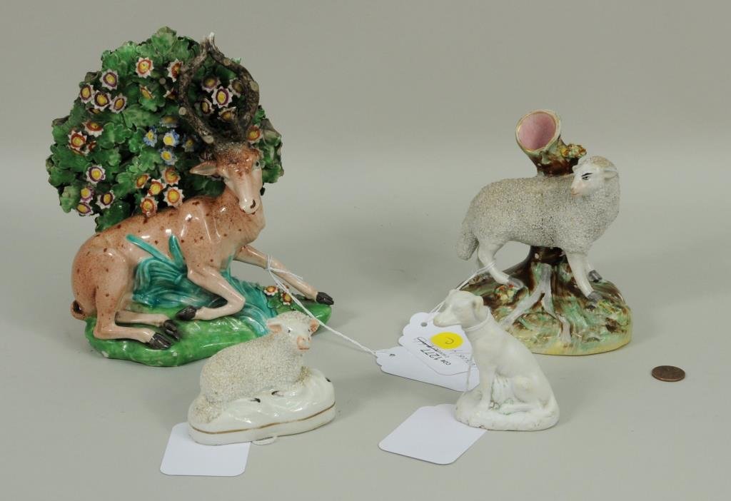 Four English Staffordshire Figures: Four English Staffordshire figures, comprising an English Staffordshire stag figurine, a Staffordshire sheep vase, a Staffordshire small sheep figurine, and a Parian dog figurine. 2 1/2" high, 3 1/4" 