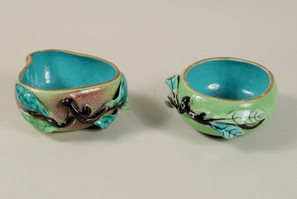 Two Chinese Glazed Earthenware Bowls: Two Chinese glazed earthenware bowls, in the form of fruit, with multi-colored glazes. Each approximately 5" high, 5 1/2" diameter.Condition: peach with small chip to one leaf, two small glaze chips t