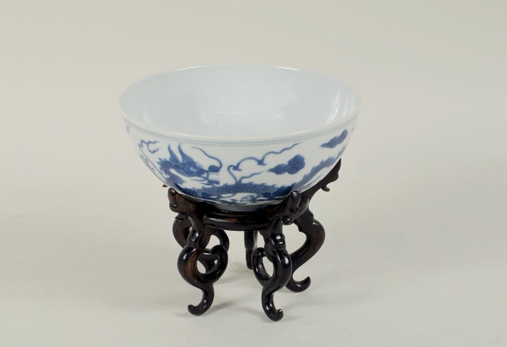 Chinese Dao Guang Blue/ White Porcelain Bowl/Stand: Chinese Dao Guang blue and white porcelain bowl on wood stand, circa 1825 - 1850. 2 1/2" high, 5 3/4" diameter.