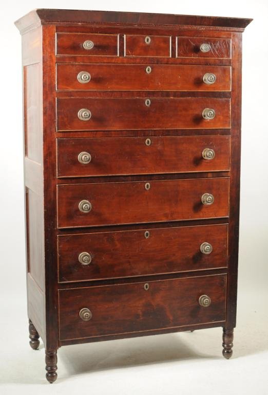 Pennsylvania Sheraton Cherry Wood Tall Chest: Pennsylvania Sheraton cherry wood tall chest, having a shaped cornice over narrow barber pole inlay, two narrow horizontal short drawers flanking central locking drawer over six graduated locking draw