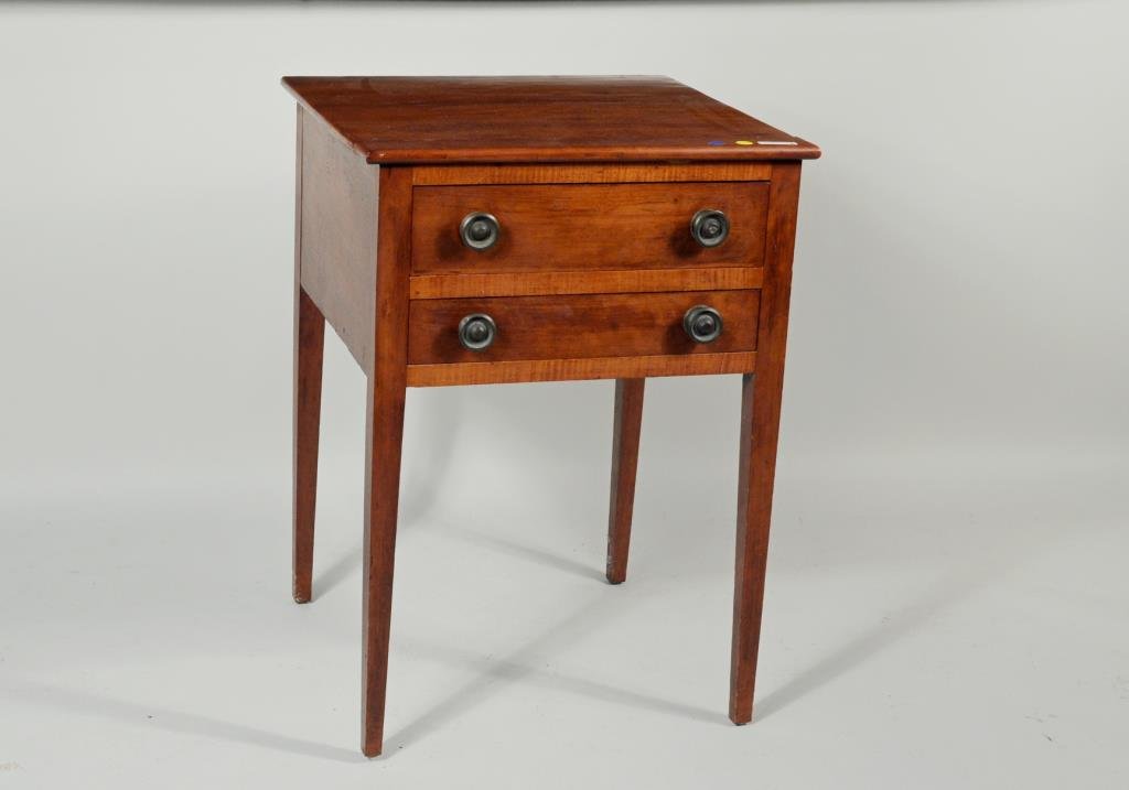 Hepplewhite Maple Two Drawer Stand: Hepplewhite maple two drawer stand, front with tiger maple rails. 29" high, 20 1/2" wide, 20 1/4 deep. Condition: top needs re-gluing, protruding screw in back leg, edge chips, age crack to top.