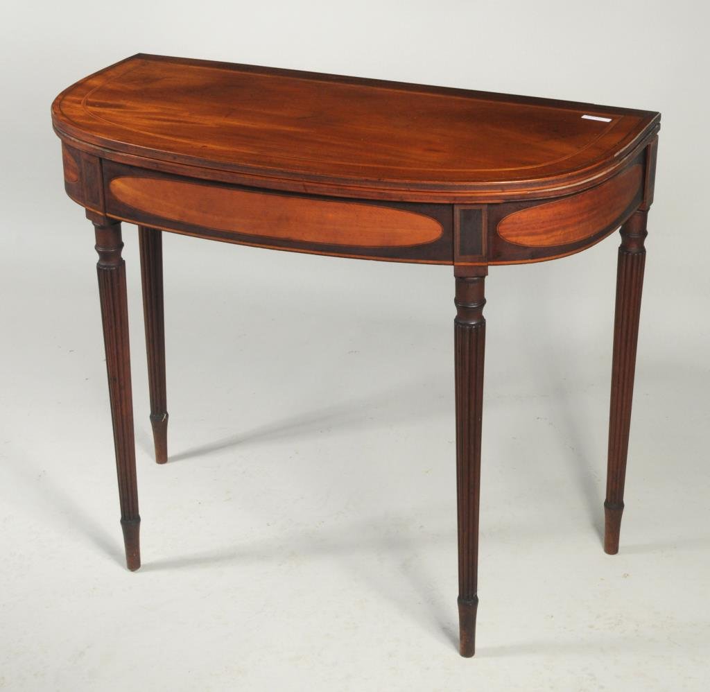 American Sheraton Inlaid Mahogany Game Table: American Sheraton inlaid mahogany "D" form card table, with inlaid details and oval inlaid lightwood panels in apron, reeded legs, North Shore Mass., circa 1810. 36" wide, 17 1/2" deep, 28 1/2" high. 