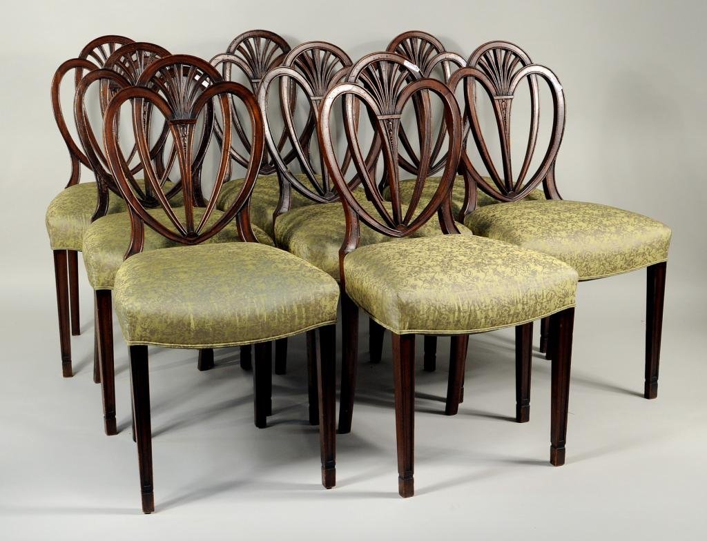 Set 8 Hepplewhite Style Heart Back Side Chairs: Set of eight Hepplewhite style mahogany heart back form side chairs, 20th century, upholstered in green silk. 38" high, 19" wide, 18" deep. Condition: a few small upholstery stains.