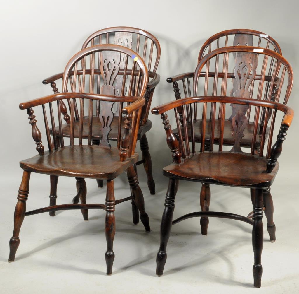 Set Four English Windsor Arm Chairs: Set of four English Windsor arm chairs with pierce carved back splats, turned arm supports and legs. 36 1/6" high, 23" wide, 15 1/4" deep. Condition: age cracks, stains, repairs.